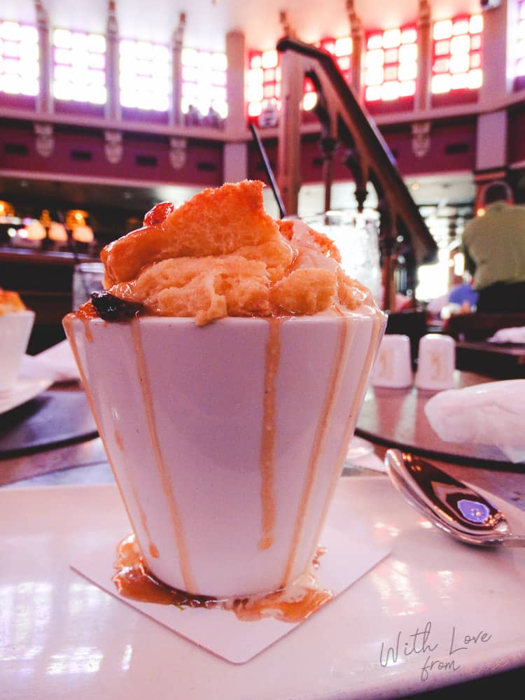 cup of bread pudding with caramel sauce dripping down the side of the bowl at disney's raglan road pub