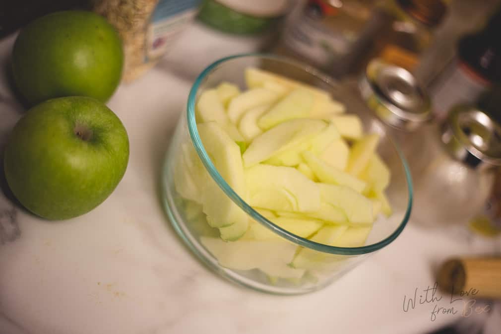 bowl filled with slices granny smith apples