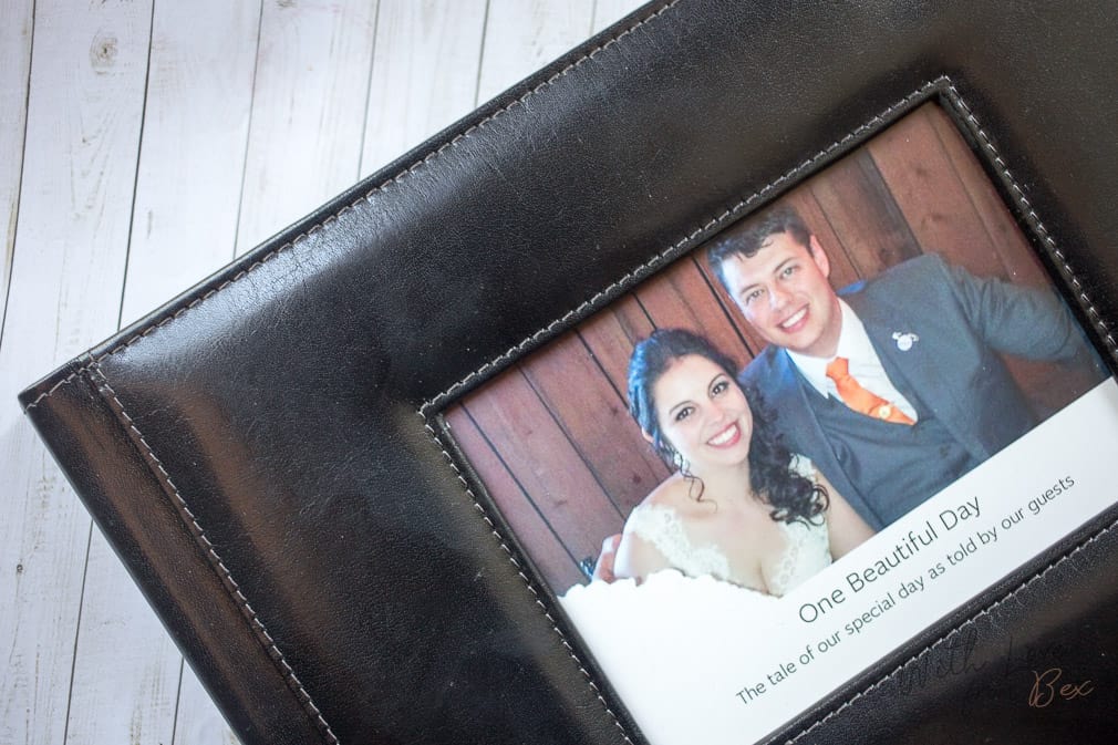 photograph of happy couple on their wedding on the front of a leather photo album